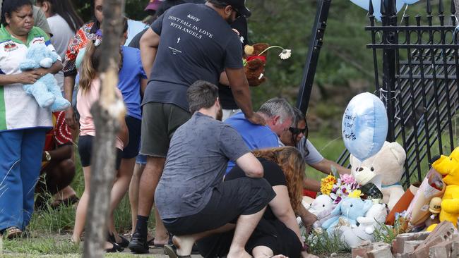 Joseph Shorey with his daughter Shanice Shorey at the crash site on Warne St in Wellington. Picture: Jonathan Ng