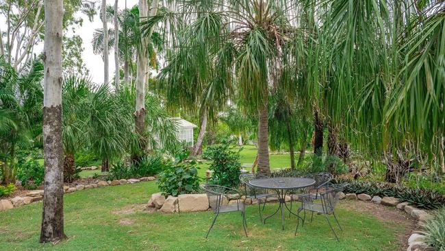 The one-acre property is fully fenced with stunning gardens, a fire pit area, French style green house and a garden rotunda. Picture: Contributed