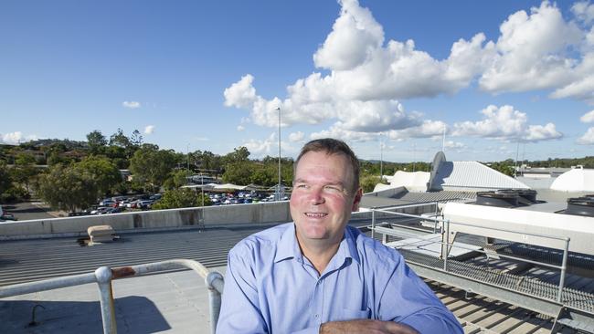 QIC Regional Manager Mark Selvey on the Hyperdome roof last year before the panels were installed. Picture: Renae Droop