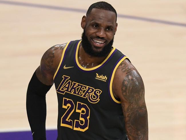 LOS ANGELES, CALIFORNIA - MARCH 12: LeBron James #23 of the Los Angeles Lakers smiles during a 105-100 Lakers win over the Indiana Pacers at Staples Center on March 12, 2021 in Los Angeles, California. (Photo by Harry How/Getty Images)  NOTE TO USER: User expressly acknowledges and agrees that, by downloading and/or using this Photograph, user is consenting to the terms and conditions of the Getty Images License Agreement. Mandatory Copyright Notice: Copyright 2021 NBAE.