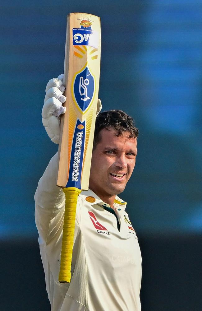 Alex Carey celebrates after scoring his first overseas century. Picture: AFP