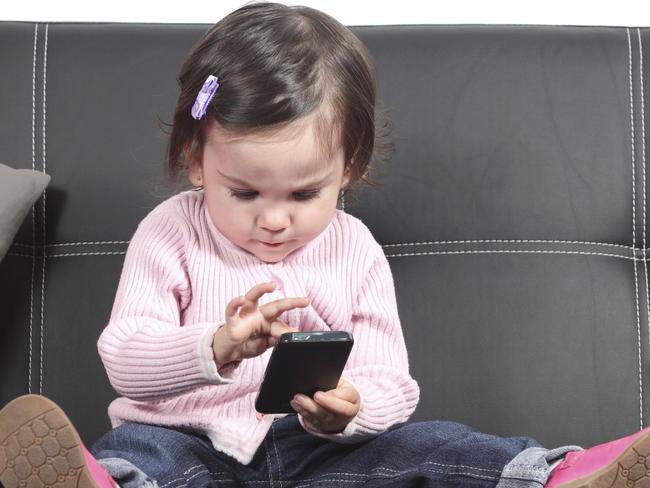 Cute baby browsing in a smartphone