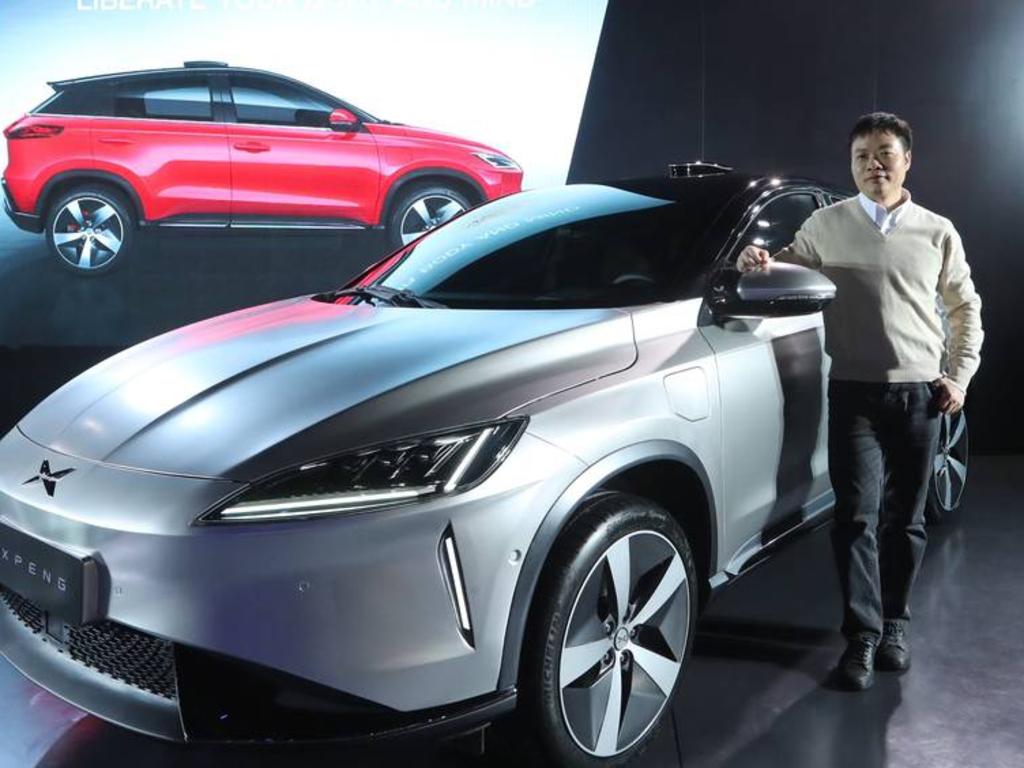 Xiaopeng He, chairman of Xiaopeng Motors with the company's newest sport-utility vehicle, the G3. Picture: XPeng