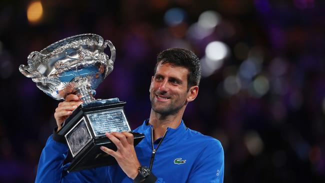 MELBOURNE, AUSTRALIA - JANUARY 27:  Novak Djokovic of Serbia poses with the Norman Brookes Challenge Cup following victory in his Men's Singles Final match against Rafael Nadal of Spain during day 14 of the 2019 Australian Open at Melbourne Park on January 27, 2019 in Melbourne, Australia.  (Photo by Michael Dodge/Getty Images)