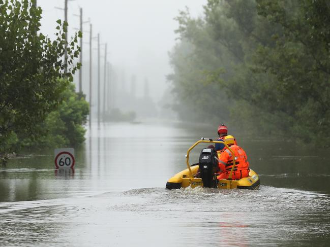 SYDNEY, AUSTRALIA - MARCH 23: State Emergency Service workers drive their rescue craft through the flooded Hawkesbury river along Inalls lane in Richmond on March 23, 2021 in Sydney, Australia. Evacuation warnings are in place for parts of Western Sydney as floodwaters continue to rise. (Photo by Mark Kolbe/Getty Images)