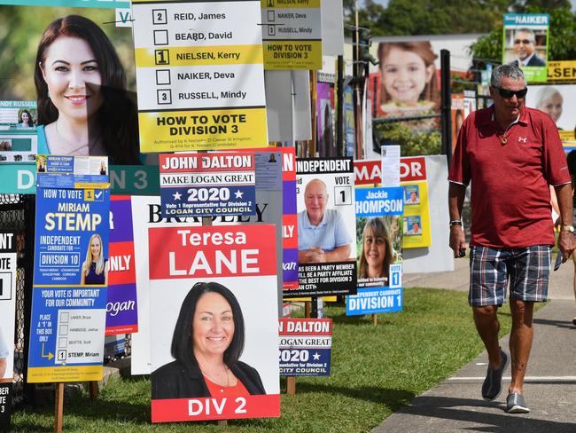 Voters in the Logan City Council election are seen at a pre-polling booth in the suburb of Slacks Creek in Logan City, Thursday, March 26, 2020. Queensland's local government elections are due to be held on Saturday despite the threat of the Coronavirus (COVID-19).  (AAP Image/Darren England) NO ARCHIVING