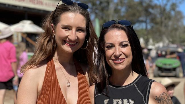 Maddy Lyons and Jude Smith, from the Gold Coast and Melbourne, enjoy day one of the 2024 Gympie Muster, at the Amamoor State Forest on August 22, 2024.