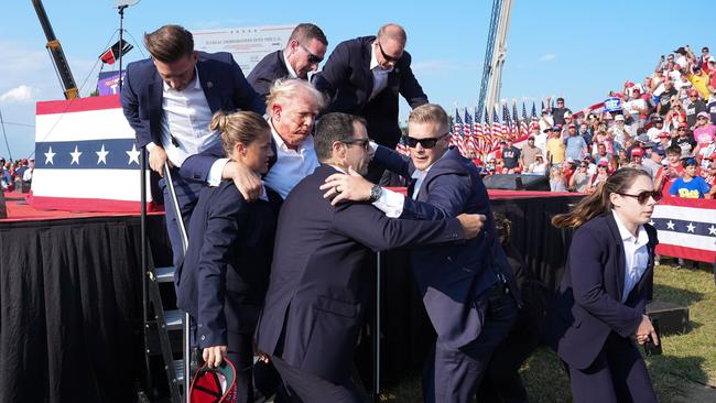 Donald Trump assisted offstage following the assassination attempt. Picture: Getty Images