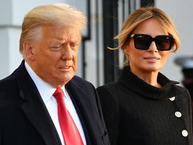 (FILES) US President Donald Trump and First Lady Melania Trump make their way to board Marine One as they depart the White House in Washington, DC, on January 20, 2021. Extremely discreet in the White House and even more reserved since leaving Washington, Melania Trump is keeping observers guessing whether she will appear, however warily, on the campaign trail alongside her husband. Aloof and enigmatic, the Slovenian-born former model has been noticeably absent as husband Donald Trump makes his third bid for the White House. (Photo by MANDEL NGAN / AFP)