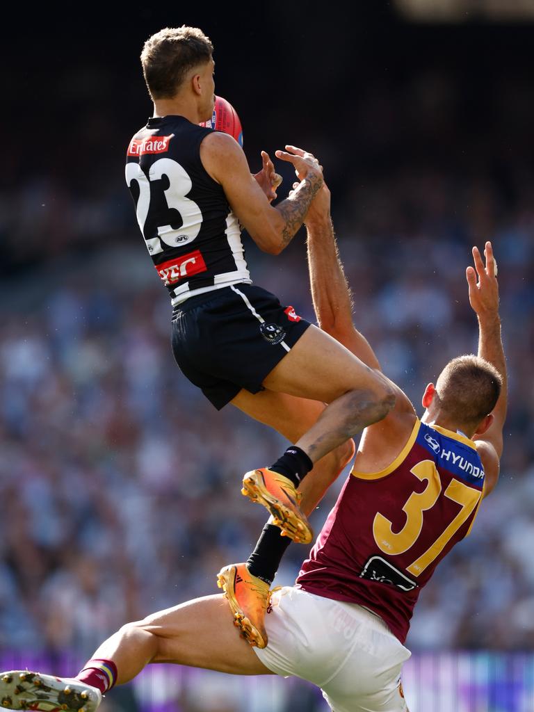 Bobby Hill takes a screamer over Brandon Starcevich of the Lions. (Photo by Michael Willson/AFL Photos via Getty Images)