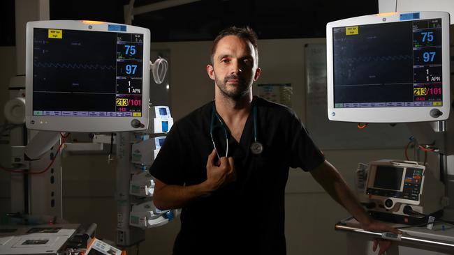 The Night Watch - ED Dr Tom Wallis pictured in the emergency department of the Northern Beaches Hospital. He has been on the Covid-19 frontline, setting up clinics and treating patients. Picture: Toby Zerna