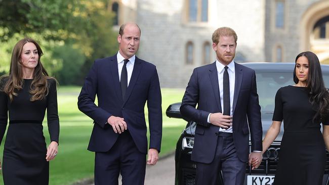 WINDSOR, ENGLAND - SEPTEMBER 10: Catherine, Princess of Wales, Prince William, Prince of Wales, Prince Harry, Duke of Sussex, and Meghan, Duchess of Sussex on the long Walk at Windsor Castle arrive to view flowers and tributes to HM Queen Elizabeth on September 10, 2022 in Windsor, England. Crowds have gathered and tributes left at the gates of Windsor Castle to Queen Elizabeth II, who died at Balmoral Castle on 8 September, 2022. (Photo by Chris Jackson/Getty Images)