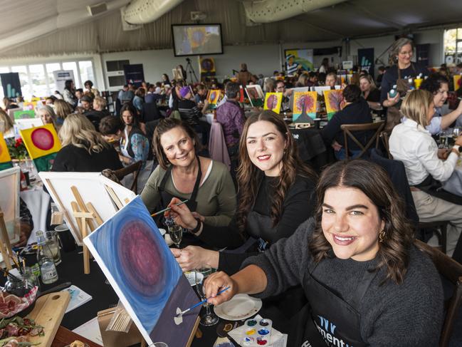 Participating in the World's Largest Paint and Sip Luncheon are (from left) Tracey Scanlan, Alarha Miller and Miriam Spina for Momentum Mental Health at Clifford Park racecourse, Friday, June 21, 2024. Picture: Kevin Farmer