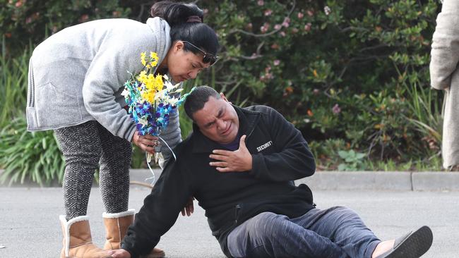 Solomone’s parents at the carpark where he was killed in June. Picture: David Crosling