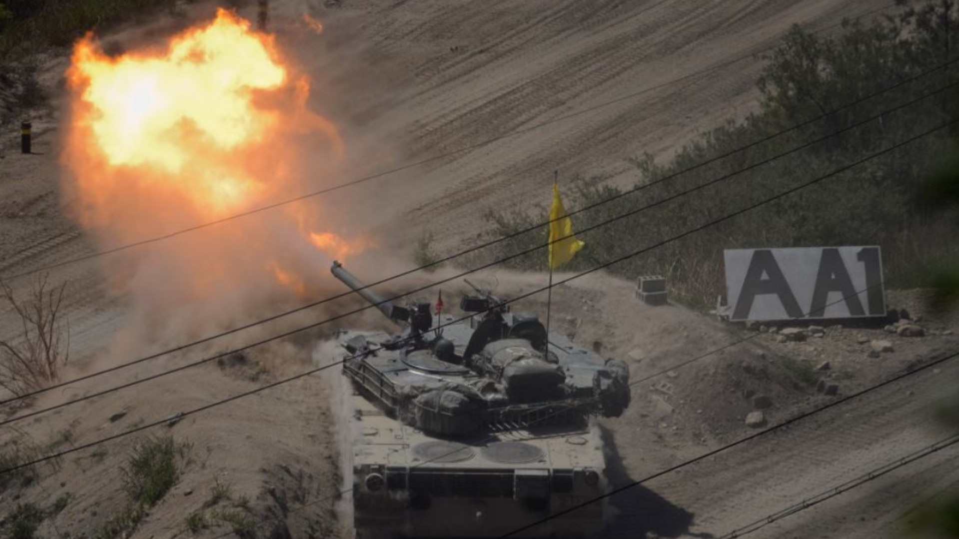 (FILES) In file photo taken on May 20, 2015 a South Korean tank of the 8th Mechanized Infantry Division takes part in a live-fire exercise at a training ground in Cheorwon, near the demilitarized zone (DMZ). South Korea on August 20, 2015 fired dozens of shells across the border into North Korea in retaliation for an apparent North Korean rocket attack, Seoul's defence ministry said. AFP PHOTO / FILES / Ed Jones