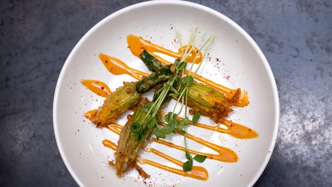 The tempura-battered zucchini flowers leave a lasting impression. Picture: Monique Harmer