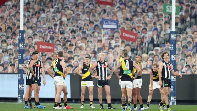 Footy like never before. Collingwood and Richmond players are used to a bigger roar at the end of a match. Picture: Michael Klein