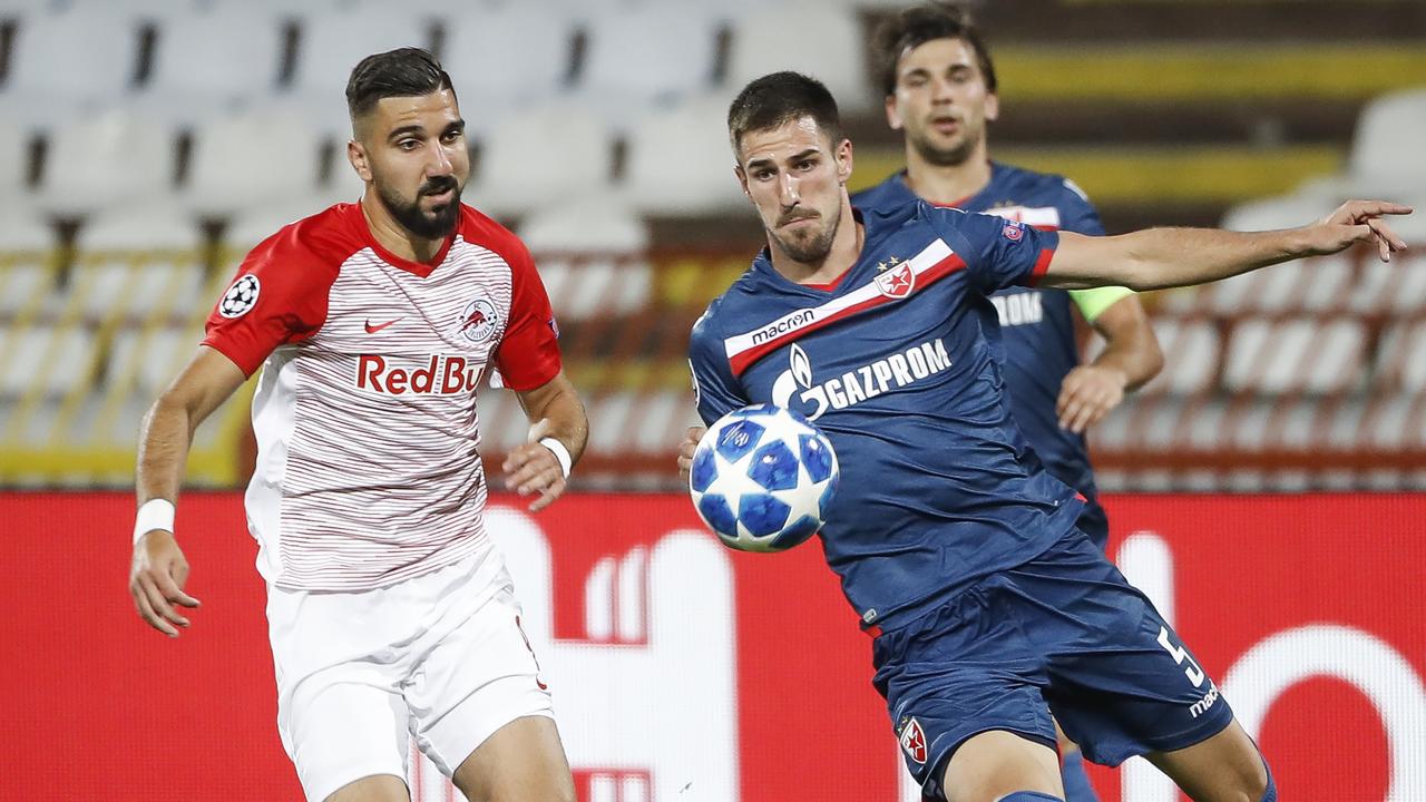 Milos Degenek (R) in action for Red Star.