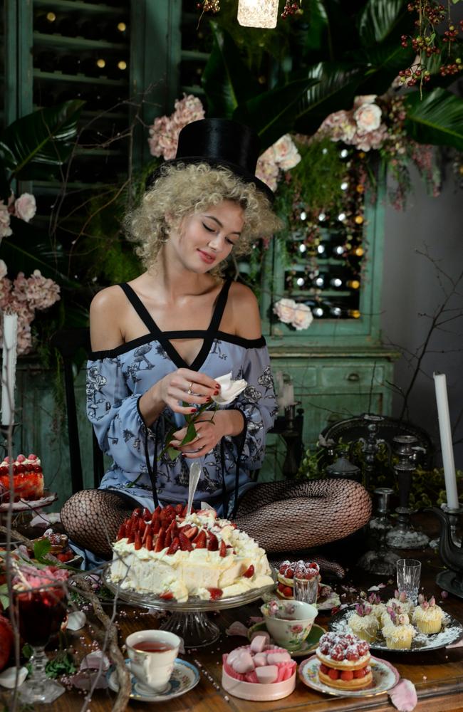 Irwin surrounded by cakes for her very own tea party during the shoot for the Seduce x Disney shoot. Picture: Margaret Zhang