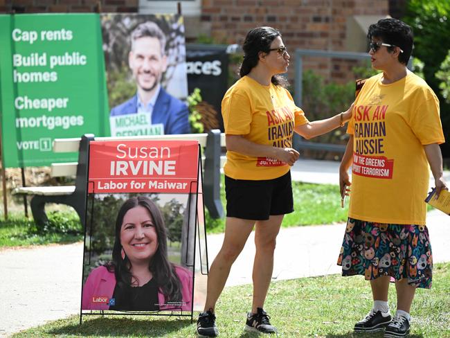 Iranians, Hindus and Queensland Jewish Collective campaign against the Greens at election booths in Maiwar, Indooroopilly, Brisbane. Picture: Lyndon Mechielsen / Courier Mail