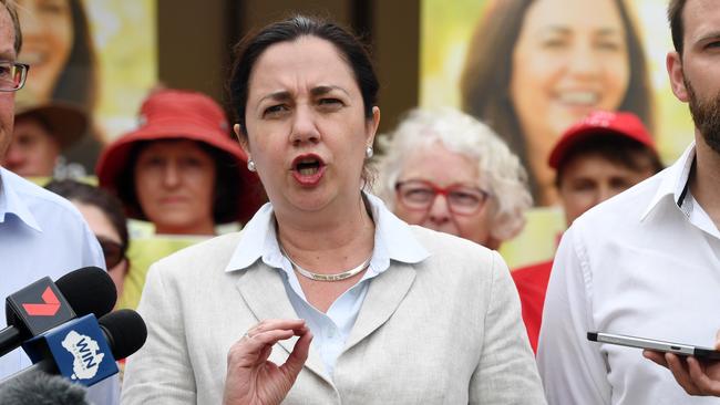 Queensland Premier Annastacia Palaszczuk (centre), the Labor candidate for Toowoomba North, Kerry Shine (left), and candidate for Condamine, Brendon Huybregts (right), are seen in a press conference in Toowoomba, Wednesday, November 22, 2017. Ms Palaszczuk is on the campaign trail ahead of the November 25 state election. (AAP Image/Dan Peled) NO ARCHIVING