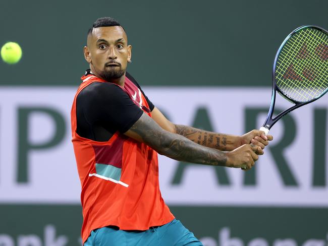 INDIAN WELLS, CALIFORNIA - MARCH 12: Nick Kyrgios of Australia returns a shot to Federico Del Bonis of Argentina during the BNP Paribas Open at the Indian Wells Tennis Garden on March 12, 2022 in Indian Wells, California. (Photo by Matthew Stockman/Getty Images)