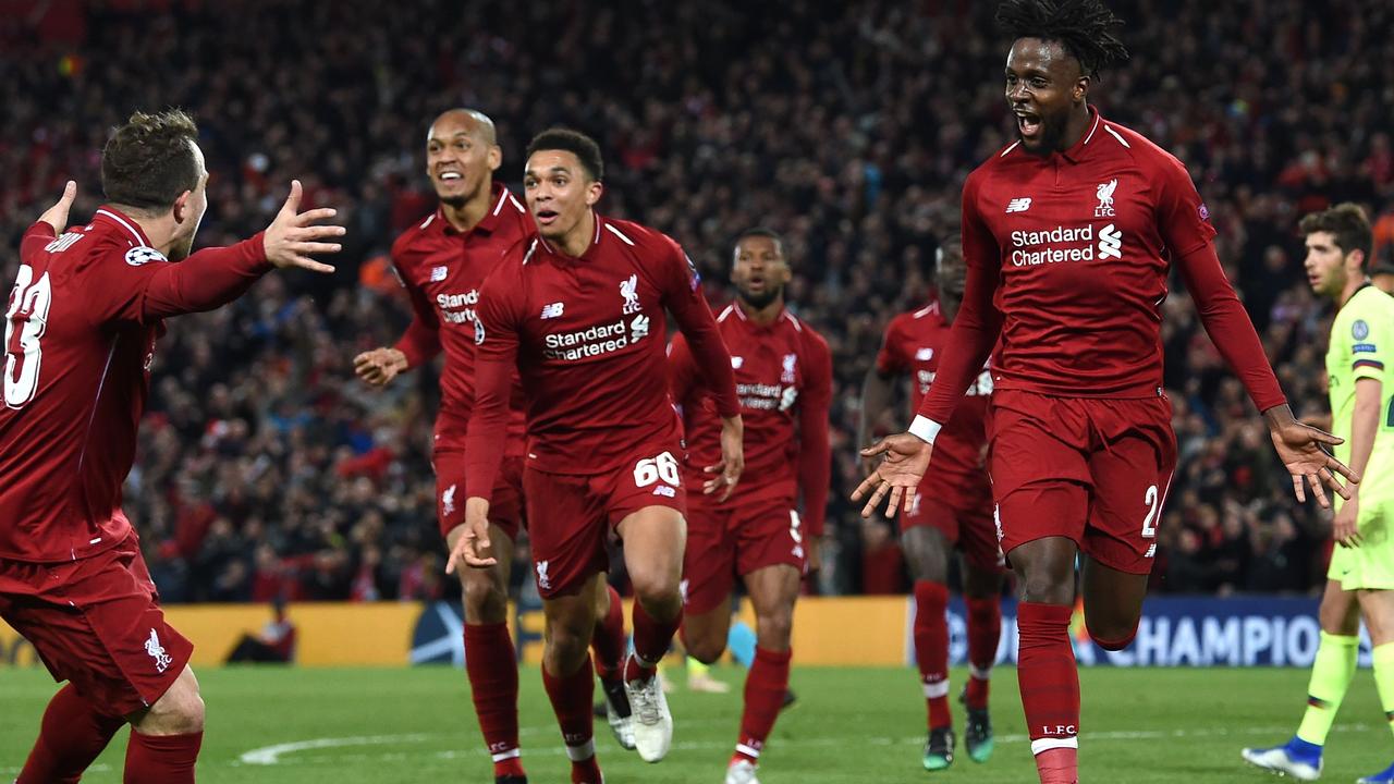 Liverpool players wheel away to celebrate during their miracle Champions League comeback against Barcelona.