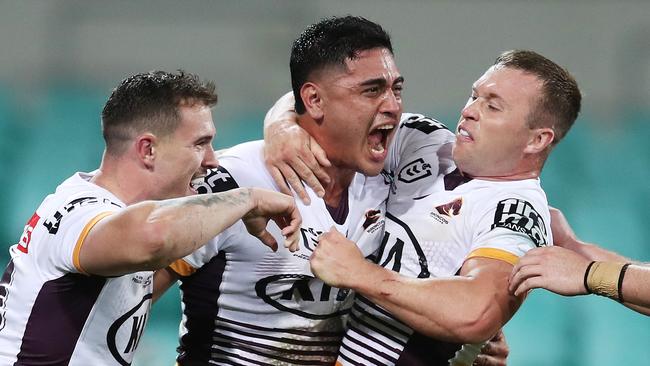 SYDNEY, AUSTRALIA - MAY 22:  Keenan Palasia of the Broncos celebrates with team mates after scoring a try during the round 11 NRL match between the Sydney Roosters and the Brisbane Broncos at Sydney Cricket Ground, on May 22, 2021, in Sydney, Australia. (Photo by Matt King/Getty Images)