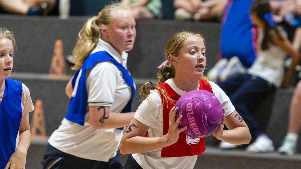 Isabella Marshall (with ball) during Toowoomba Netball Association junior representative trials at Clive Berghofer Arena, St Mary's College, Sunday, October 23, 2022. Picture: Kevin Farmer