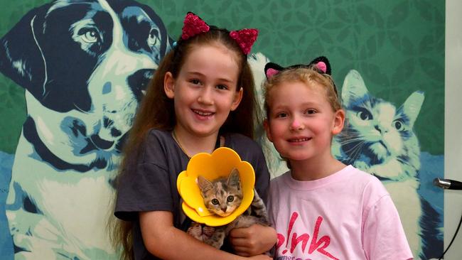 Nell Manning, 8, and Annabelle Leatham, 6, with adoption kitten Claire at the RSPCA Op Shop in West End. Picture: Evan Morgan