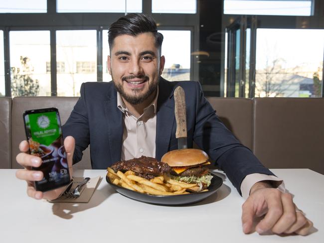 Aladdin Moukhallalati enjoys a meal at Rashays Punchbowl, a restaurant that has 100 per cent halal food. Picture: Melvyn Knipe