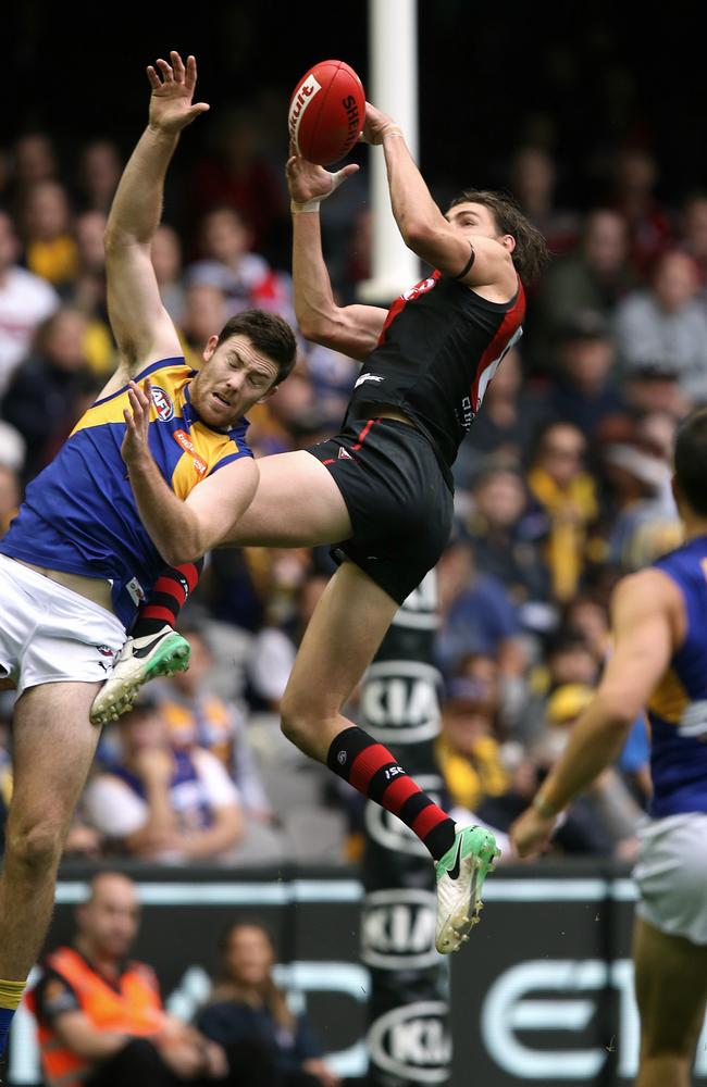 Joe Daniher flies for a mark over Jeremy McGovern. Picture: Wayne Ludbey