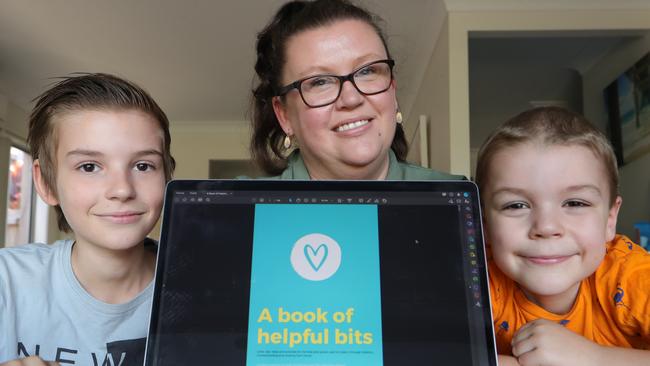 Kate Armstrong and her sons, Jack 11 and Hayden 7 (who she is teaching at home) with her new ebook on the computer. Picture: Glenn Hampson