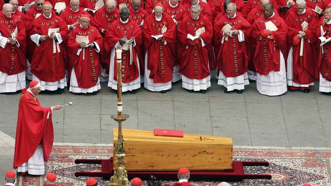 Cardinal Joseph Ratzinger blesses the coffin of Pope John Paul II. Picture: AFP