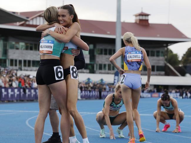 Claudia Hollingsworth hugs training partner Imogen Barrett after winning the 800 metre earlier this year. Picture: Michael Klein