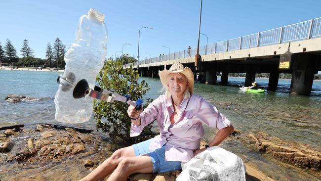 Tallebudgera Creek "fairy" Dr Sally Gregory cleaning up the beach and waterways near Tallebudgera Creek, as part of an effort to minimise harm to the environment. Picture Glenn Hampson