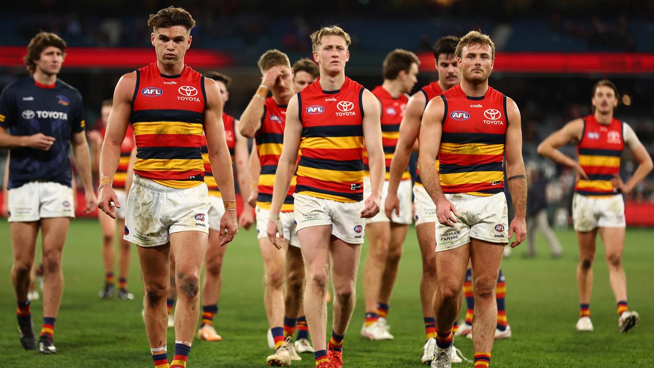 The Crows look dejected following the loss to Melbourne. Picture: Graham Denholm/AFL Photos via Getty Images