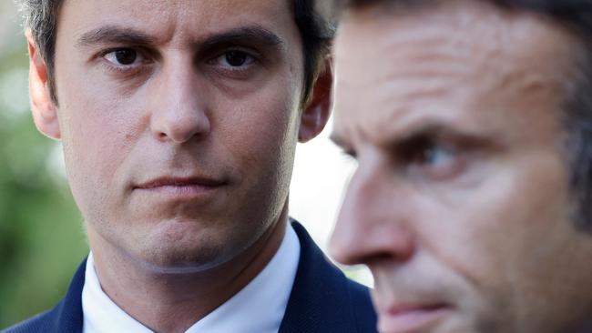 Emmanuel Macron with France’s new PM Gabriel Attal . (Photo by Ludovic MARIN / POOL / AFP)