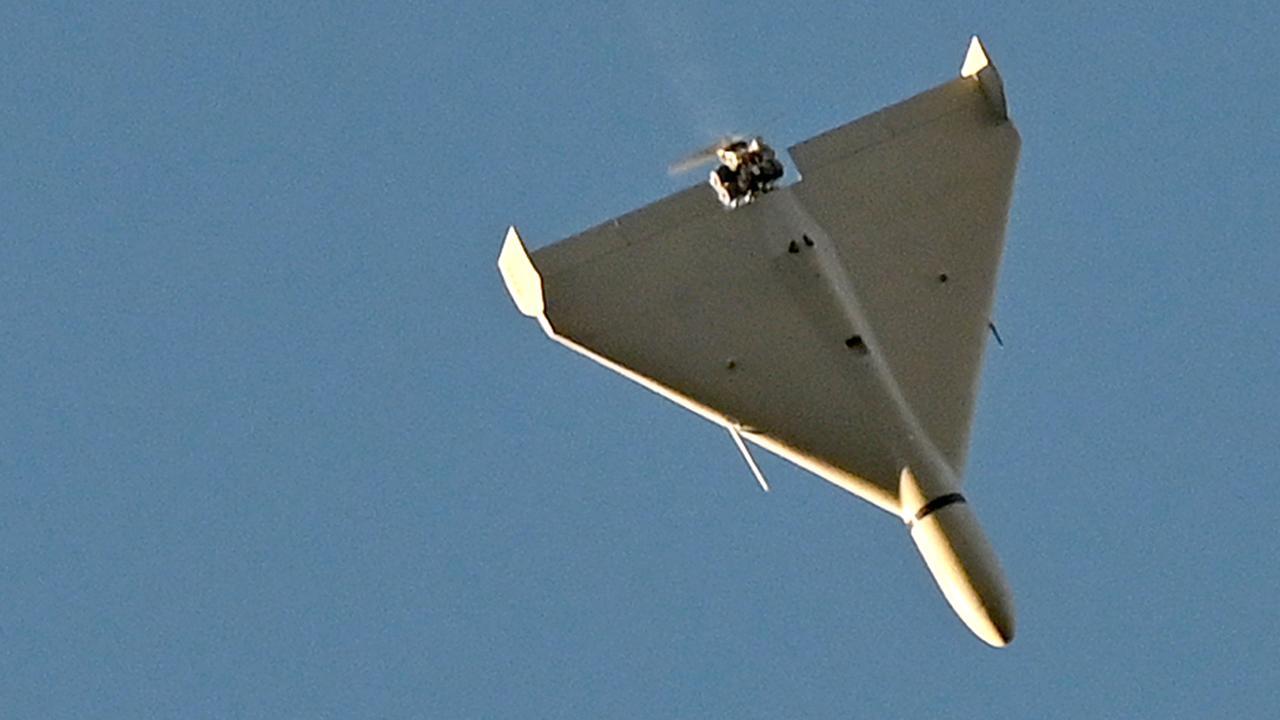 A drone flies over Kyiv during an attack on October 17. Picture: Sergei Supinksy/AFP