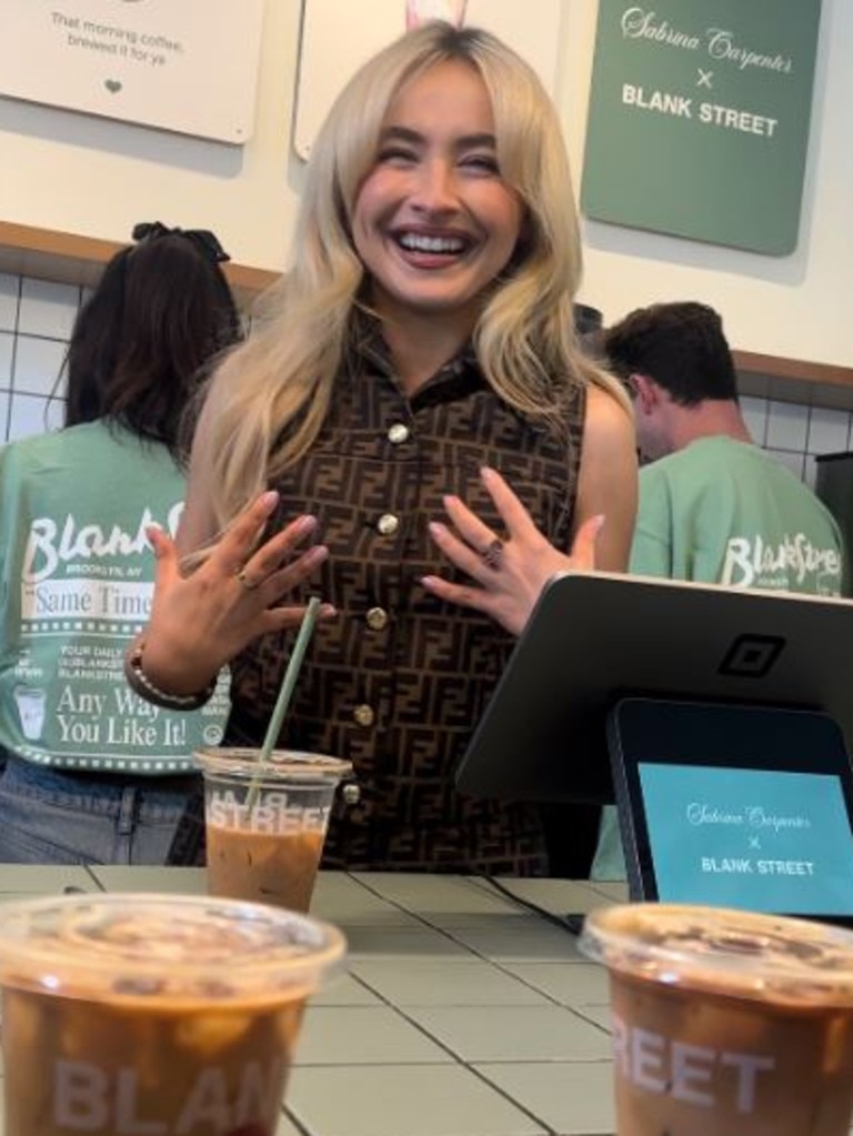 The singer worked behind the counter to serve espressos to customers.