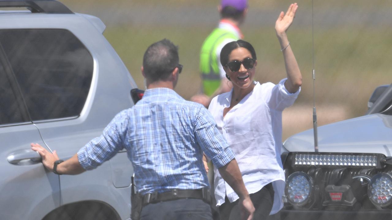 Meghan waves goodbye to Oz — but she’ll be back soon. Picture: AAP