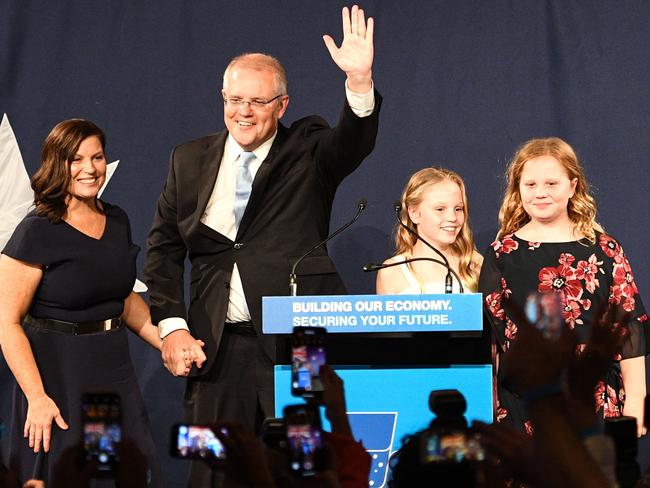 Scott Morrison with his family claiming victory on Saturday night. Picture: Saeed Khan of AFP