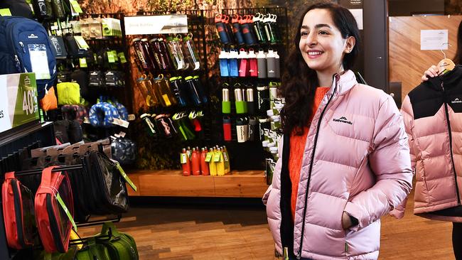 Kathmandu customer tries on a jackets. Picture: Mark Brake