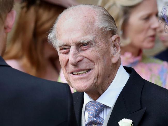 Britain's Prince Philip, Duke of Edinburgh (C) chats to Britain's Prince Harry, Duke of Sussex as they leave St George's Chapel in Windsor Castle, Windsor, west of London, on May 18, 2019, after the wedding of Lady Gabriella Windsor and Thomas Kingston. - Lady Gabriella, is the daughter of Prince and Princess Michael of Kent. Prince Michael, is the Queen Elizabeth II's cousin. (Photo by Steve Parsons / POOL / AFP)