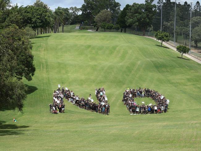 Victoria Park Olympic stadium protesters join forces to form giant human ÃNOÃ, Herston. Picture: Liam Kidston