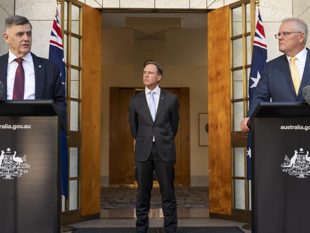 Australian Prime Minister Scott Morrison, Chief Medical Officer Dr Brenden Murphy and Minister for Health Greg Hunt as the federal government announces approval of the Pfizer COVID-19 vaccine. Picture: Martin Ollman