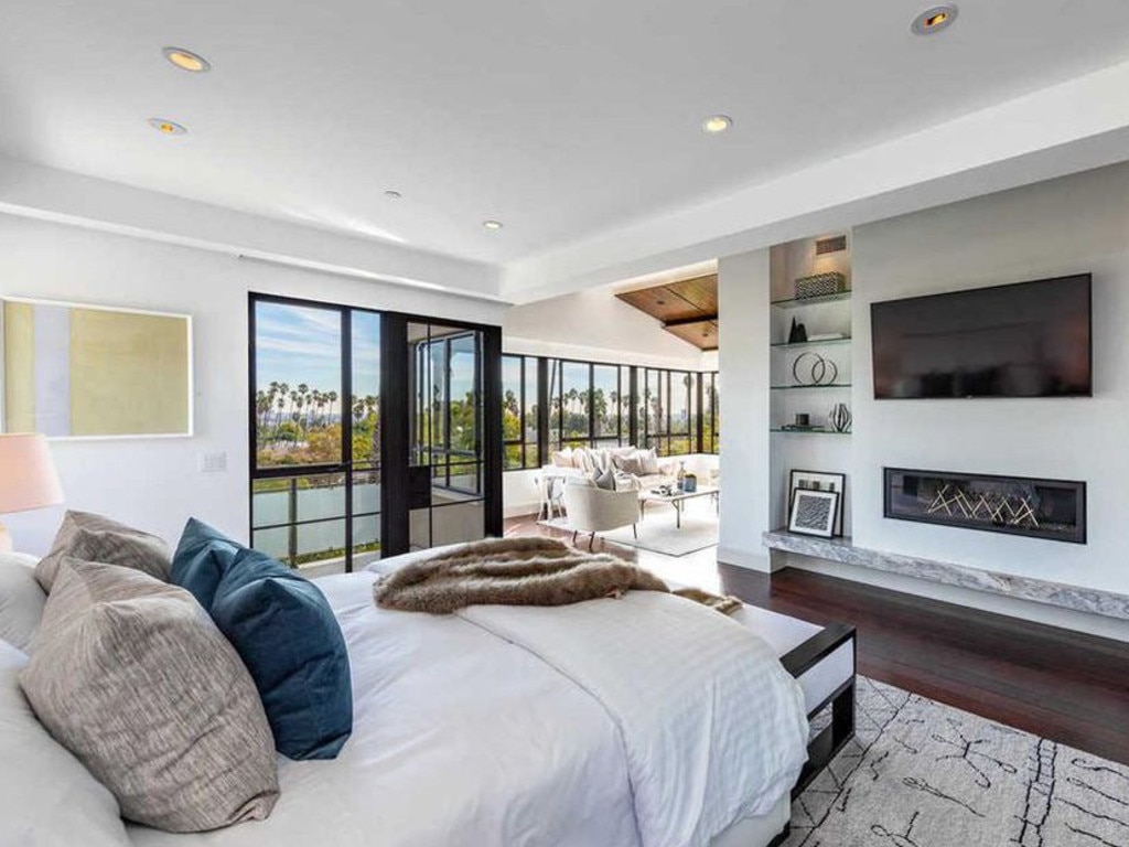 The open plan bedroom flows out into a sun room. Picture: Realtor.