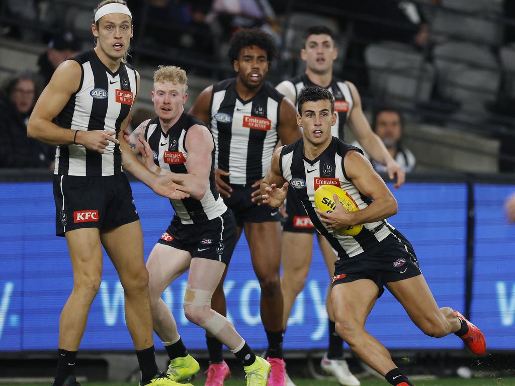 MELBOURNE, AUSTRALIA. May 11, 2024. AFL Round 10. Collingwood vs. West Coast Eagles at Marvel Stadium. Nick Daicos of the Magpies clears in front of his defenders during the 3rd qtr. . Pic: Michael Klein