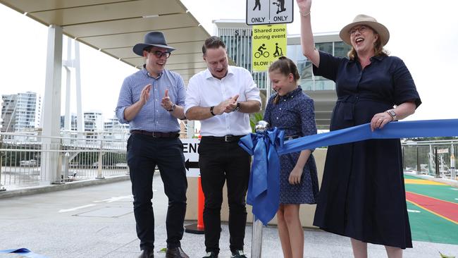 Lord Mayor Adrian Schrinner, second from left, cuts the ribbon with federal Infrastructure Minister Catherine King, right, at the opening of the Kangaroo Point Bridge in Brisbane. Picture: Lachie Millard