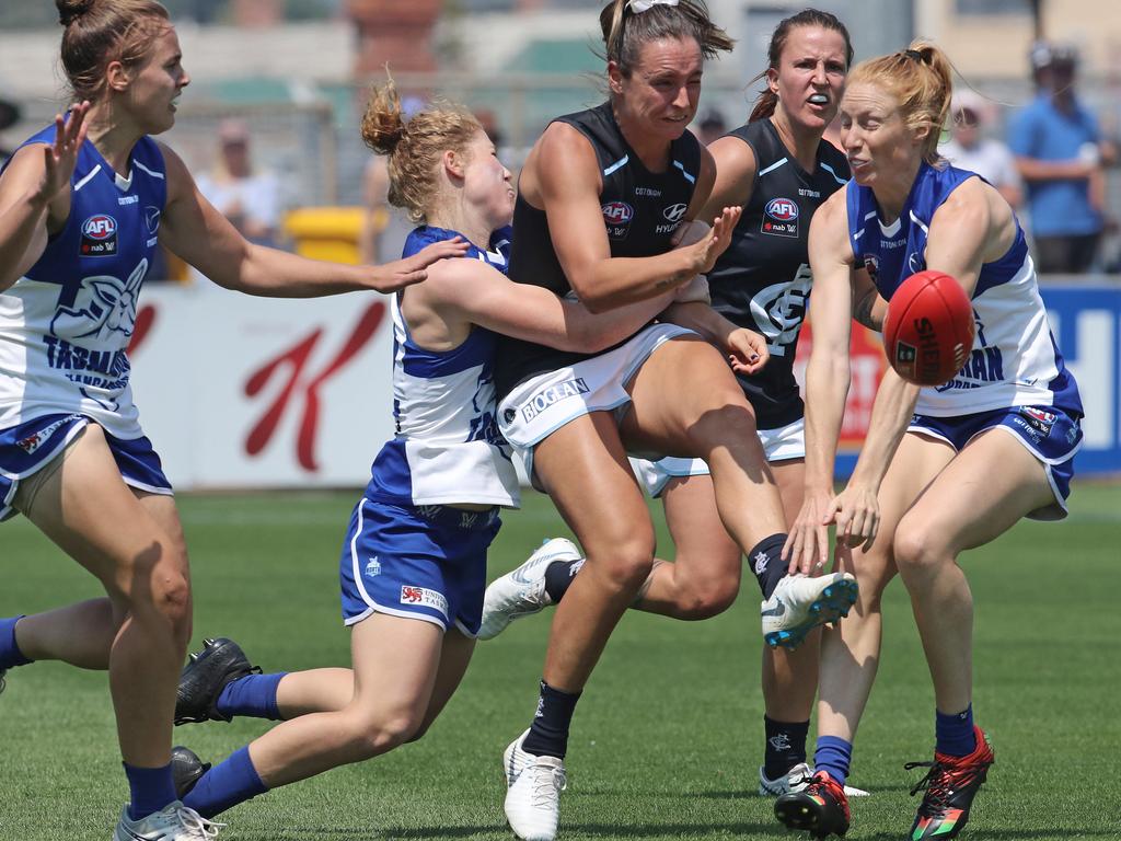 Carlton’s Alison Downie, centrem swamped by North Melbourne players. Picture: LUKE BOWDEN